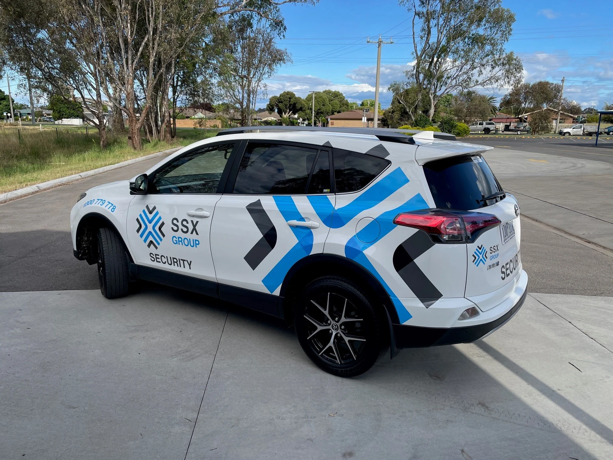 Cut-vinyl lettering and logo applied to a security patrol vehicle