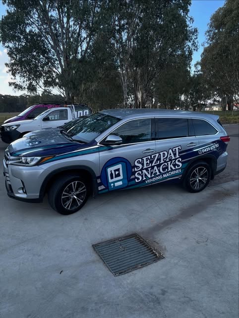 SUV brand wrap with printed door graphics for a vending machine business
