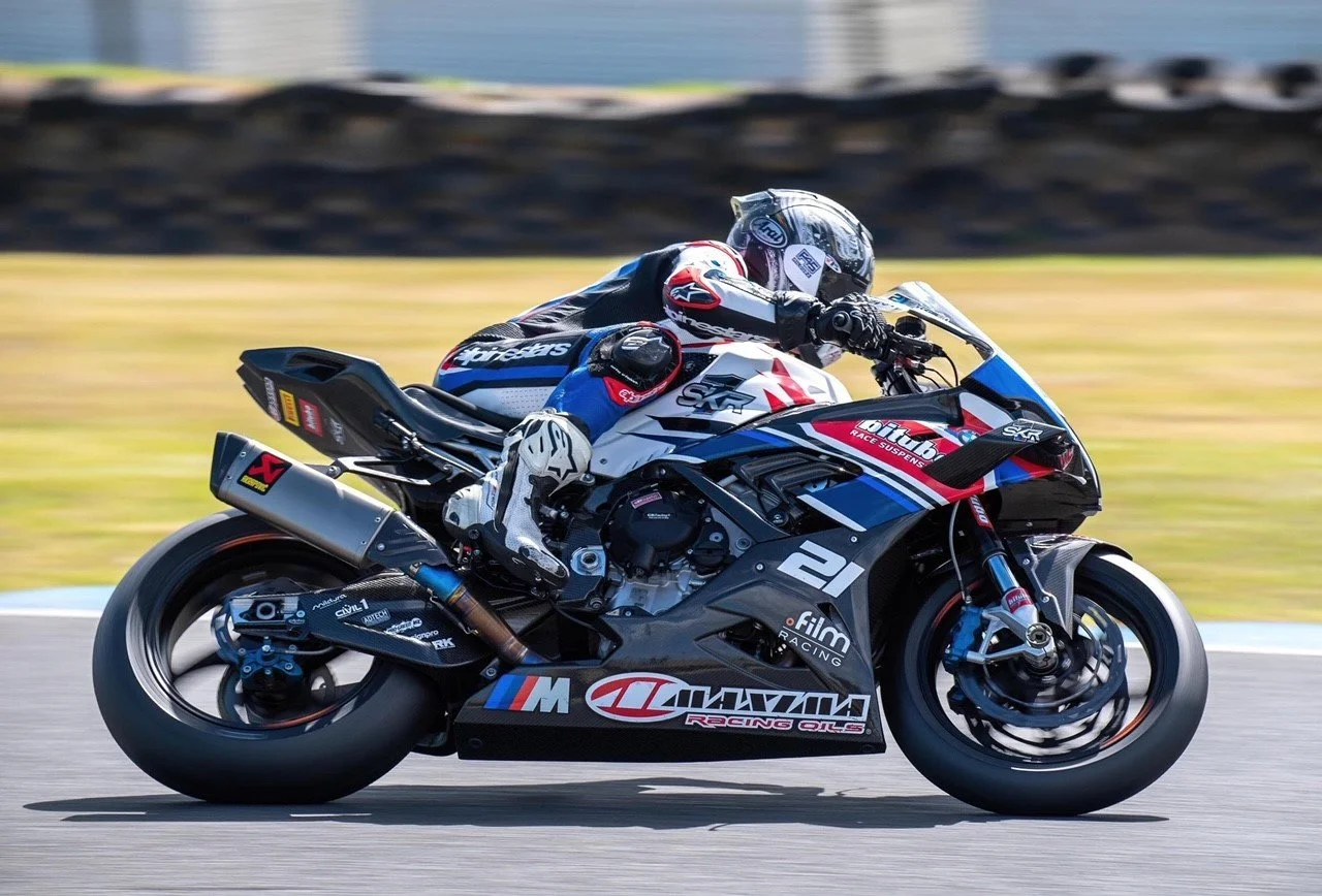 Sponsor livery decals on a racing superbike at speed