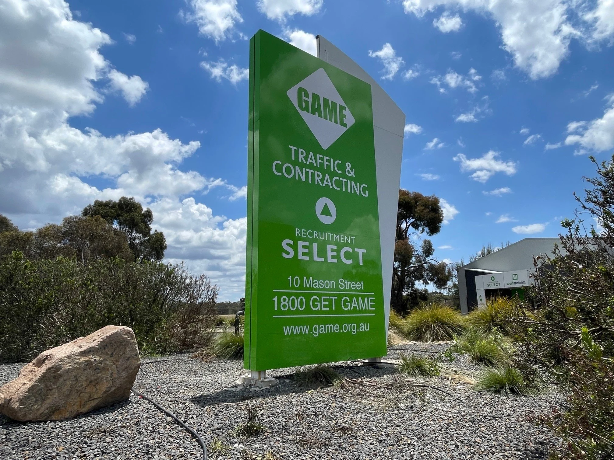 Double-sided ACM pylon sign directing traffic to a civil contractor depot