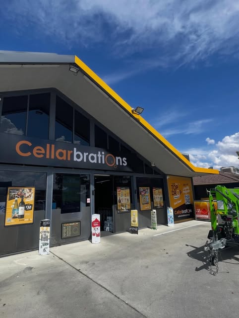 Retail shopfront fascia signage on a bottle shop in North East Victoria