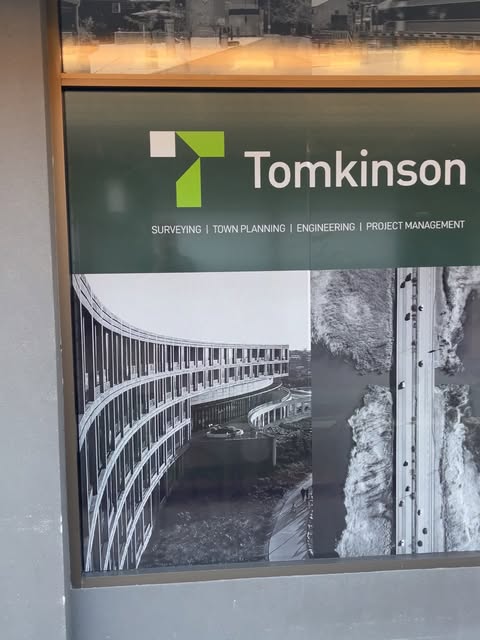 Cut vinyl lettering across a professional services office frontage